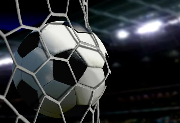 Ball im Tornetz mit Stadionscheinwerfern — Stockfoto
