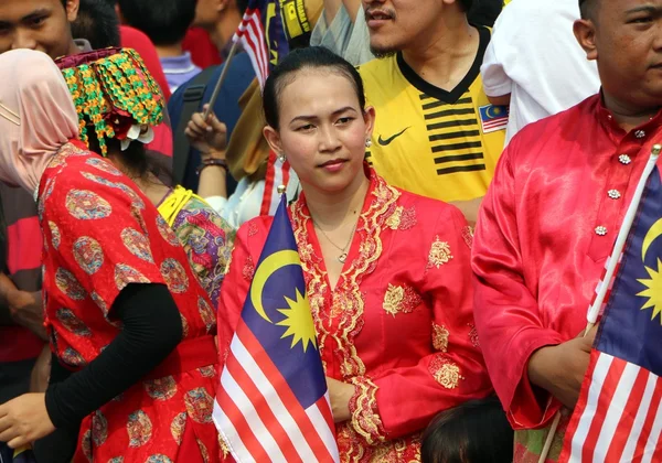 Unidentified young  woman holding Malaysian flag — Stock Photo, Image