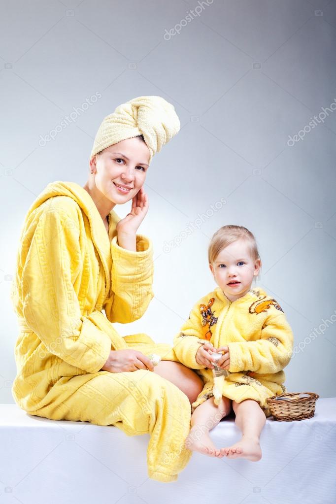 Daughter and mother putting makeup