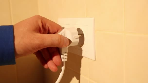 Using a wall electric socket — Stock Video