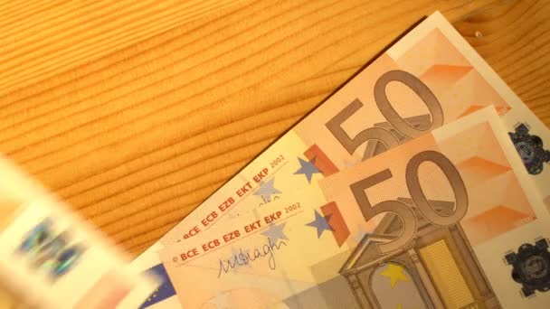 Putting euro bills — Stock Video