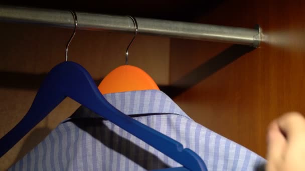 Taking a shirt from a wardrobe — Stock Video