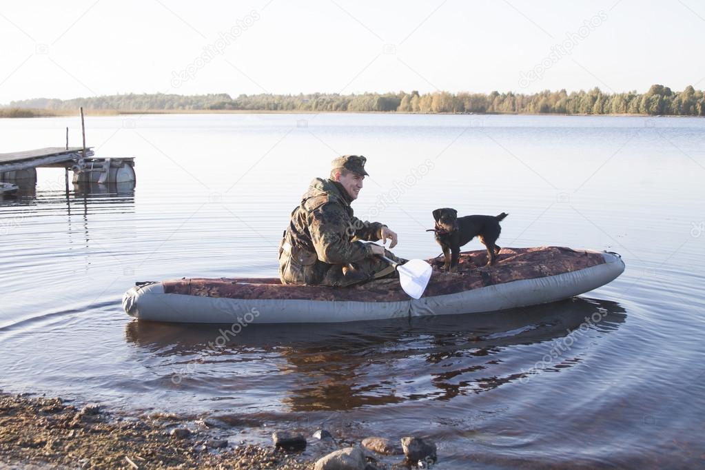 The hunter with a dog sail on hunting