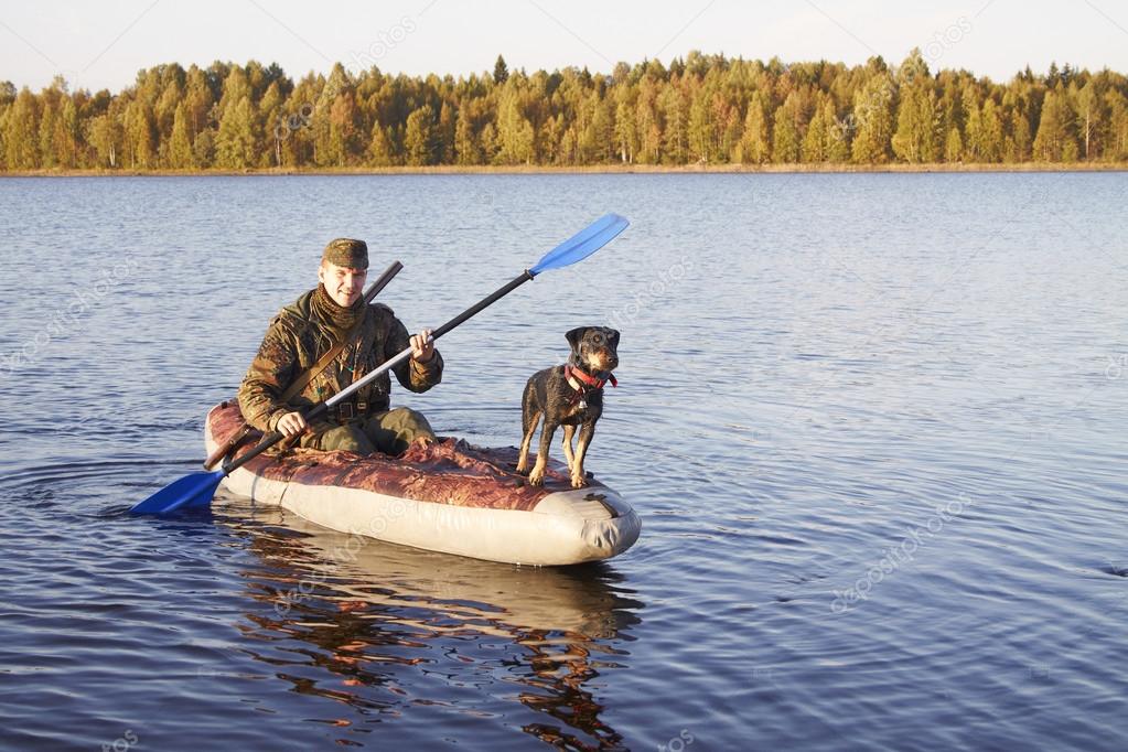 The hunter with a dog come back home — Stock Photo © morozelena 58879809