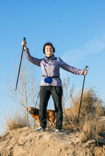 Happy woman with sticks for walking — Stock Photo, Image