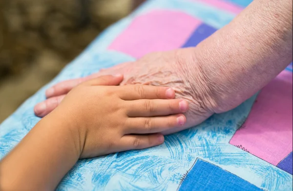 Children and old hands — Stock Photo, Image