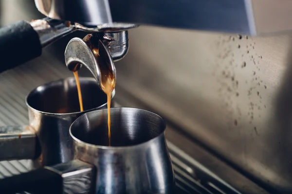 Close-up of espresso pouring from coffee machine — Stock Photo, Image