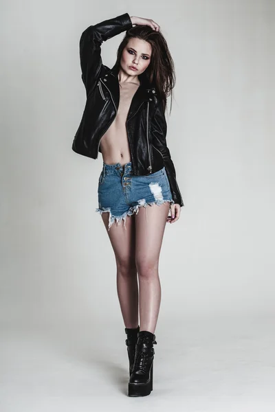 Young pretty sexy woman in leather jacket — Stock Photo, Image