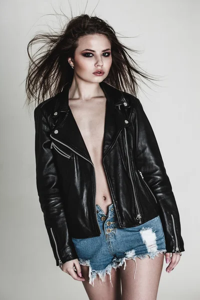 Young pretty sexy woman in leather jacket — Stock Photo, Image