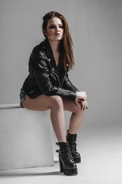 Young pretty sexy woman in leather jacket — Stock Photo, Image