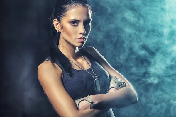 Sexy soldier woman on factory ruins — Stock Photo, Image