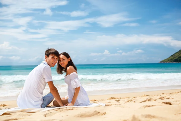 Couple on a tropical beach Stock Picture