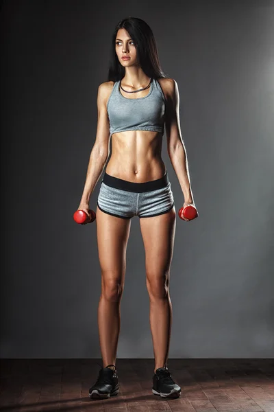 Sports young woman with dumbbells — Stock Photo, Image