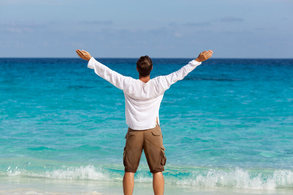 happy young man on the beach