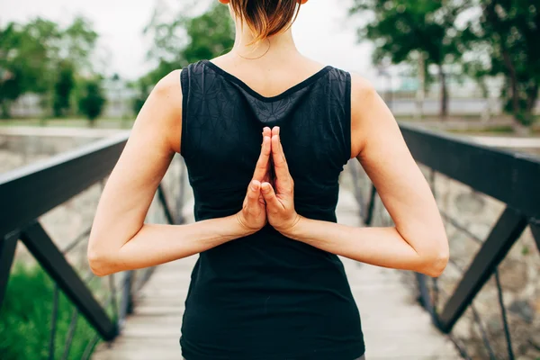 Young slim woman doing yoga — Stock fotografie