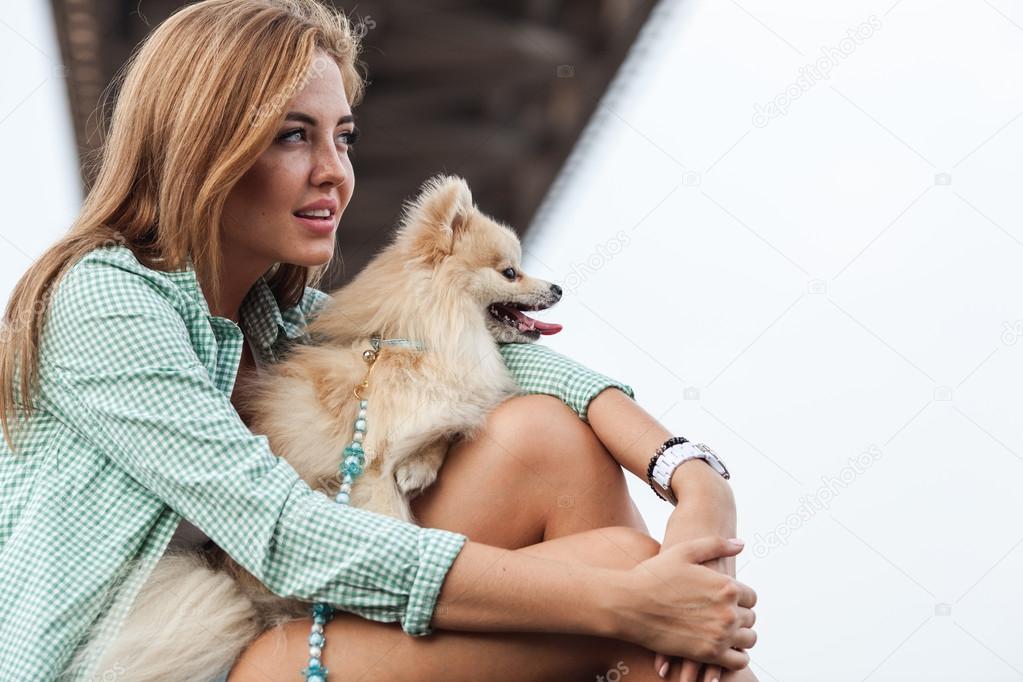 beautiful girl with her little cute dog