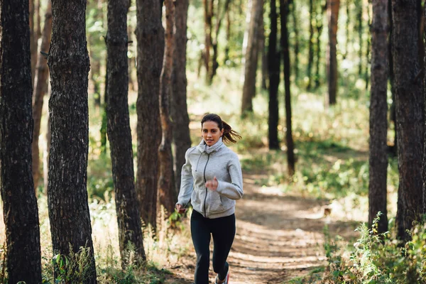 Runner woman jogging in autumn park — Stock Photo, Image