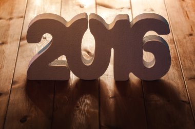 ahşap masa arka planda, yeni yıl şablon numarasını 2016
