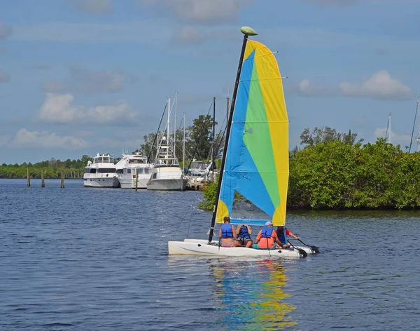 Four Vacationers on a Rental Sail Catamaran — Stock Photo, Image