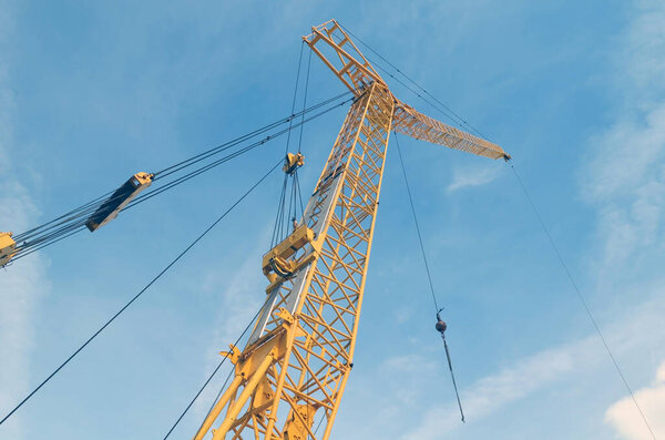Tower crane soaring high above aa Miami Beach,Florida construction site.