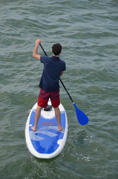 Young Man on a Blue and White Paddle Board — Stock Photo, Image