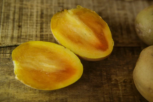 Top View of Cut into Halves Sapodilla by Intact Ones — Stock Photo, Image