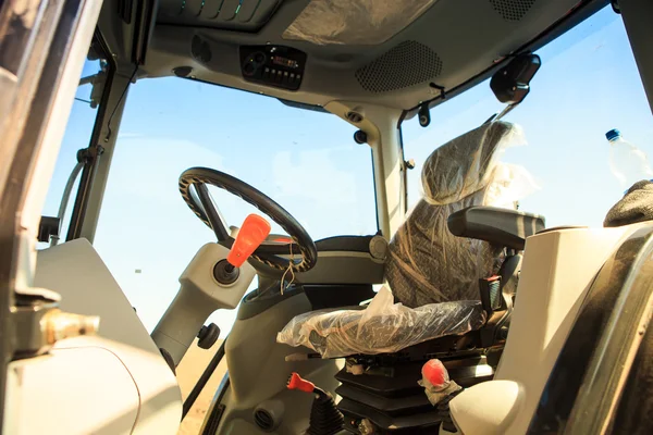 Interior view of cultivator tractor cabin with steering wheel — Stock Photo, Image