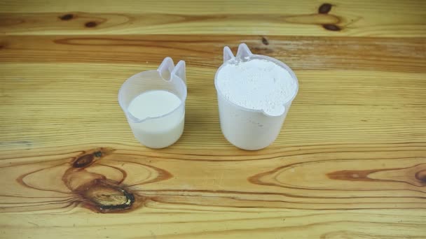 Top View Two Open Plastic Ewers Served Flour Milk Wooden — Stock Video