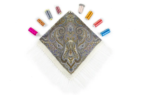 Top view on beige cotton scarf with fringe and paisley ornament designed in flat lay Stock Photo