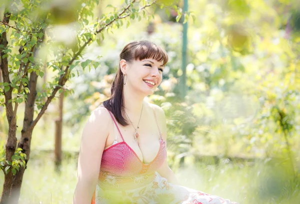 Beautiful girl in garden — Stock Photo, Image