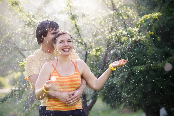Young couple in garden — Stock Photo, Image
