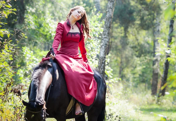 Brunette girl on horse — Stock Photo, Image