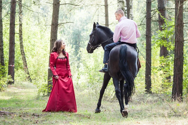 Man on horse and girl — Stock Photo, Image