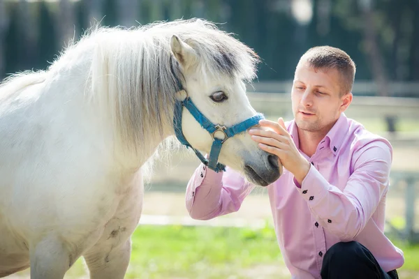 Handsome man and horse — Stock Photo, Image