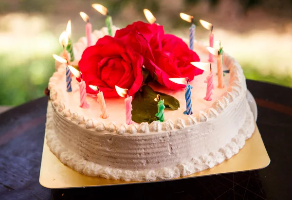 White creamy delicious cake with candles — Stock Photo, Image