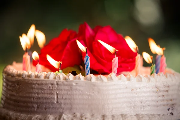 White creamy delicious cake with candles — Stock Photo, Image