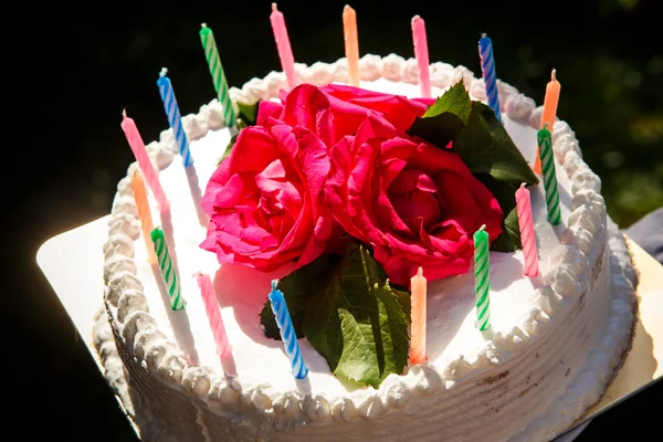 White delicious cake with candles — Stock Photo, Image