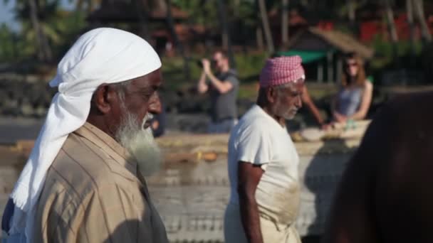 Fishermen on sea shore — Stock Video