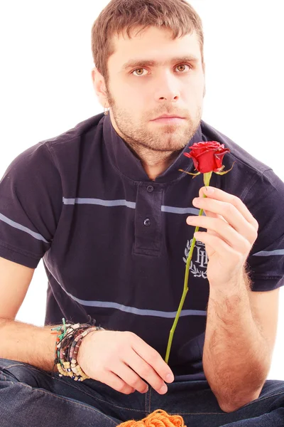 Hombre guapo con rosa roja — Foto de Stock