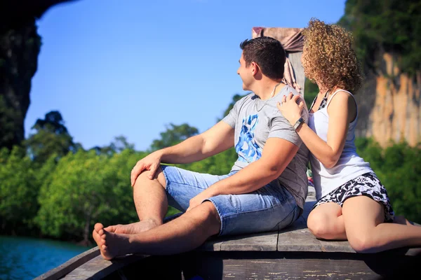 Blonde girl and man on boat — Stock Photo, Image