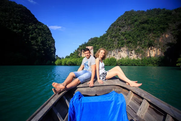 Blonde girl and man on boat — Stock Photo, Image