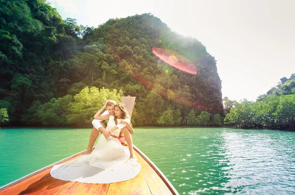 Young groom hugging his brunette bride — Stock Photo, Image