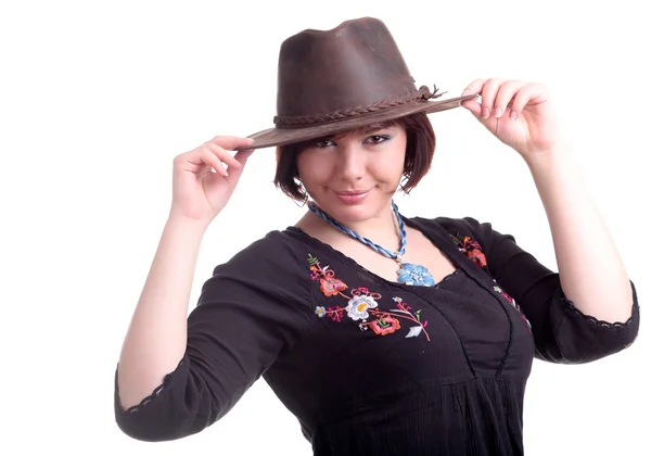 Brunette girl poses in black dress and hat — Stock Photo, Image