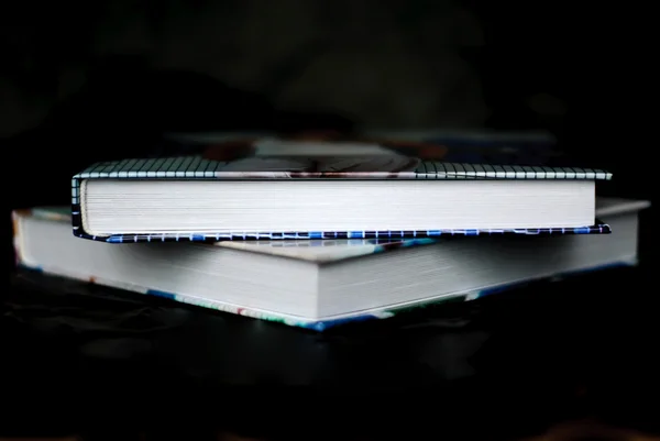 Pile of books on a black background — Stock Photo, Image