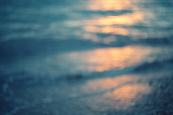Golden sunlights on blue water — Stock Photo, Image