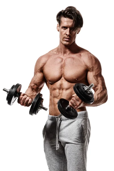 Smuk magt atletisk mand i uddannelse pumpe op muskler med - Stock-foto