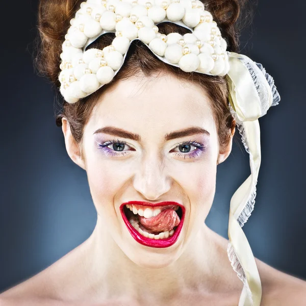 Beautiful fan girl with carnival mask on head. — Stock Photo, Image