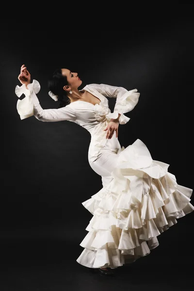 Young woman performing salsa dance with passion on black backgro — Stock Photo, Image