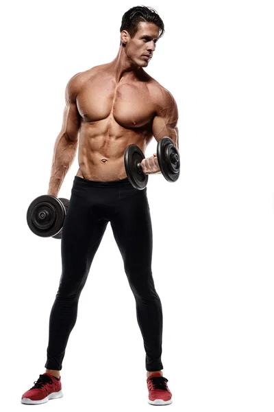 Handsome power athletic man in training pumping up muscles — Stock Photo, Image