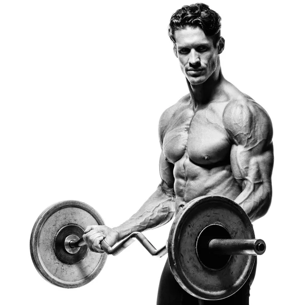 Closeup portræt af en muskuløs mand træning med vægtstang på gym . - Stock-foto